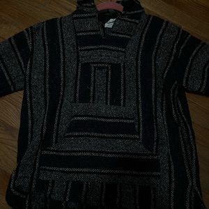 cute poncho / sweater , long sleeve, with a hoodie. very thick material